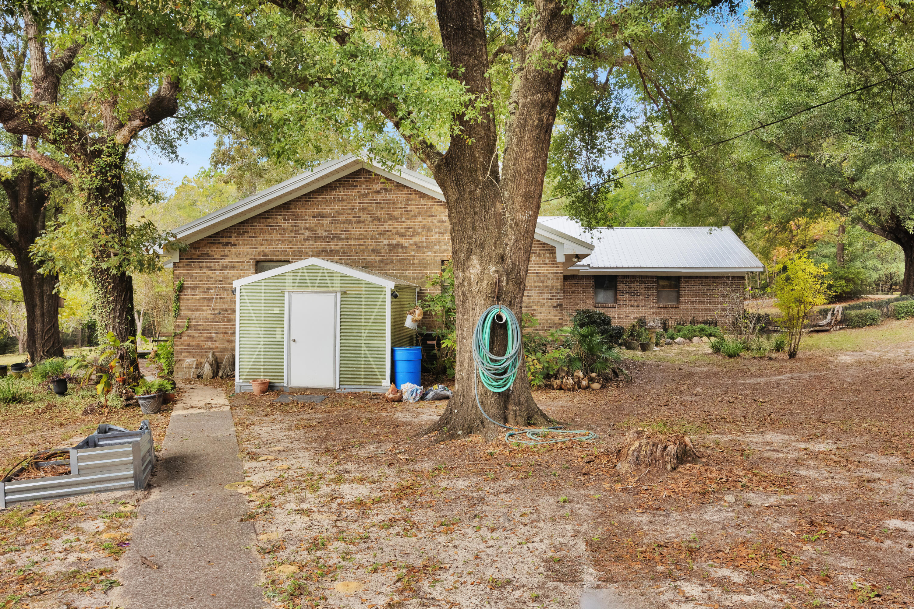 2540 Taylor Road Crestview, FL 32536 - Photo 48 of 75 a front view of a house with garden