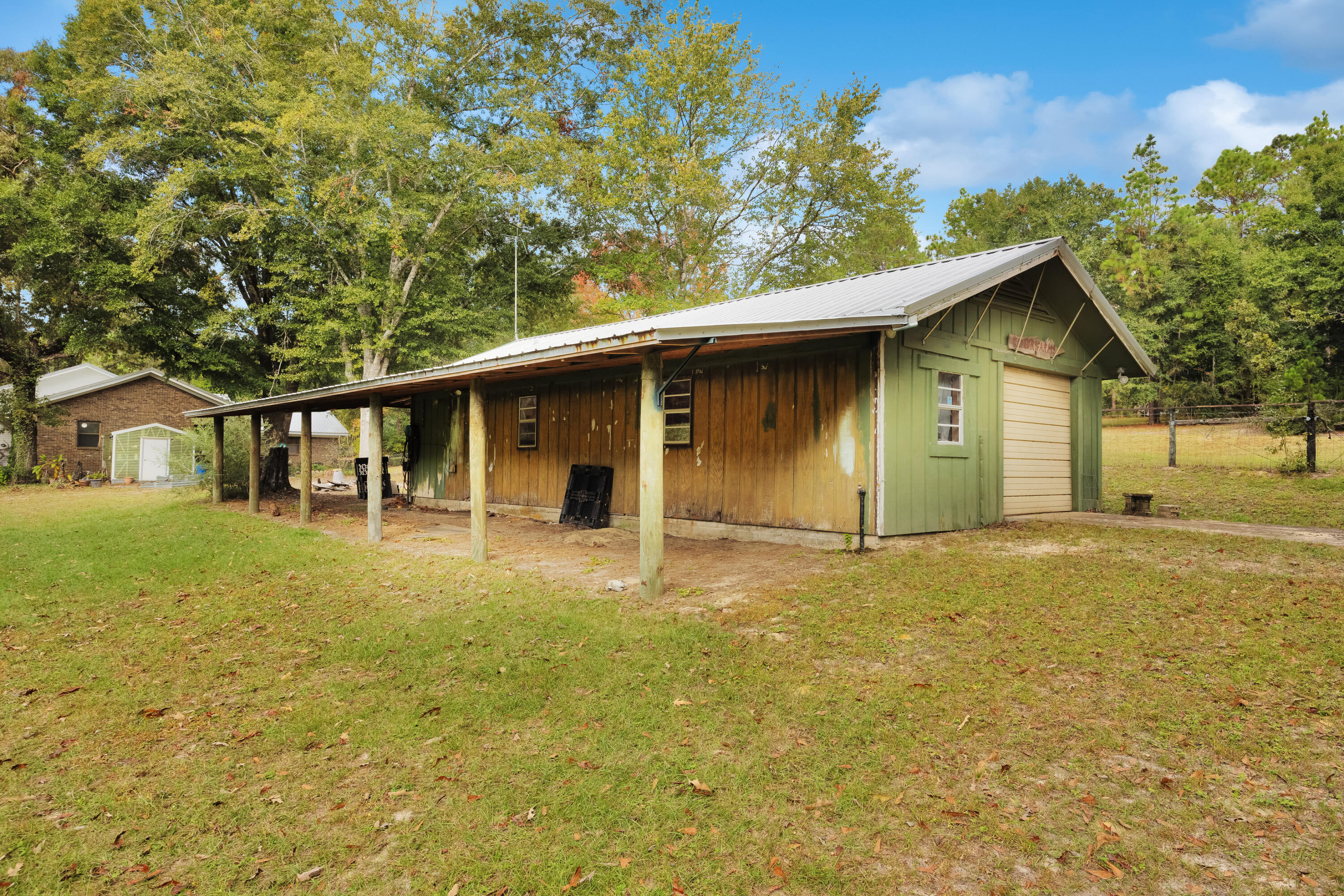 2540 Taylor Road Crestview, FL 32536 - Photo 51 of 75 a front view of a house with a yard and garage