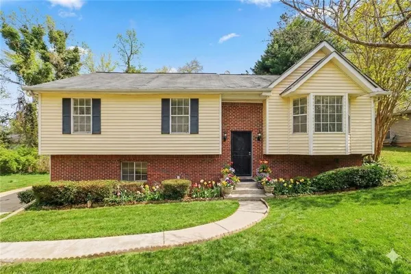 a front view of a house with a yard