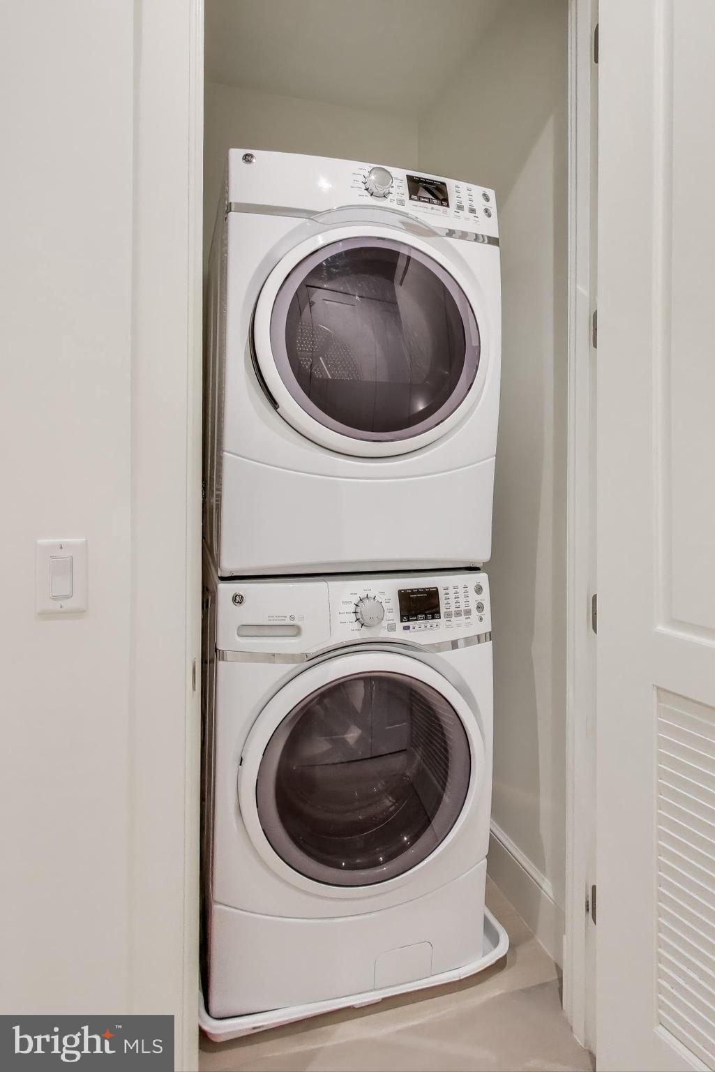2122 N Street Northwest, Unit 5 Washington, DC 20037 - Photo 23 of 38 a utility room with dryer and washer