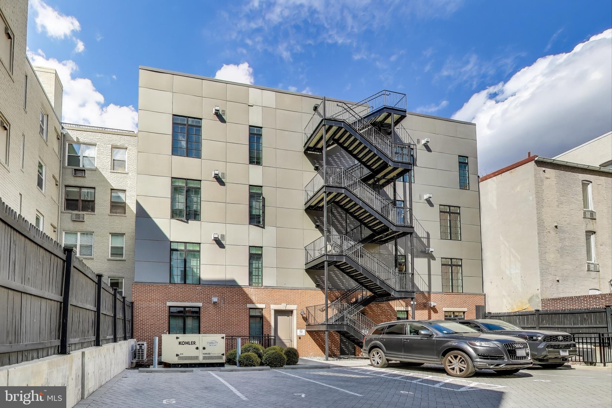 2122 N Street Northwest, Unit 5 Washington, DC 20037 - Photo 30 of 38 a car parked in front of a building