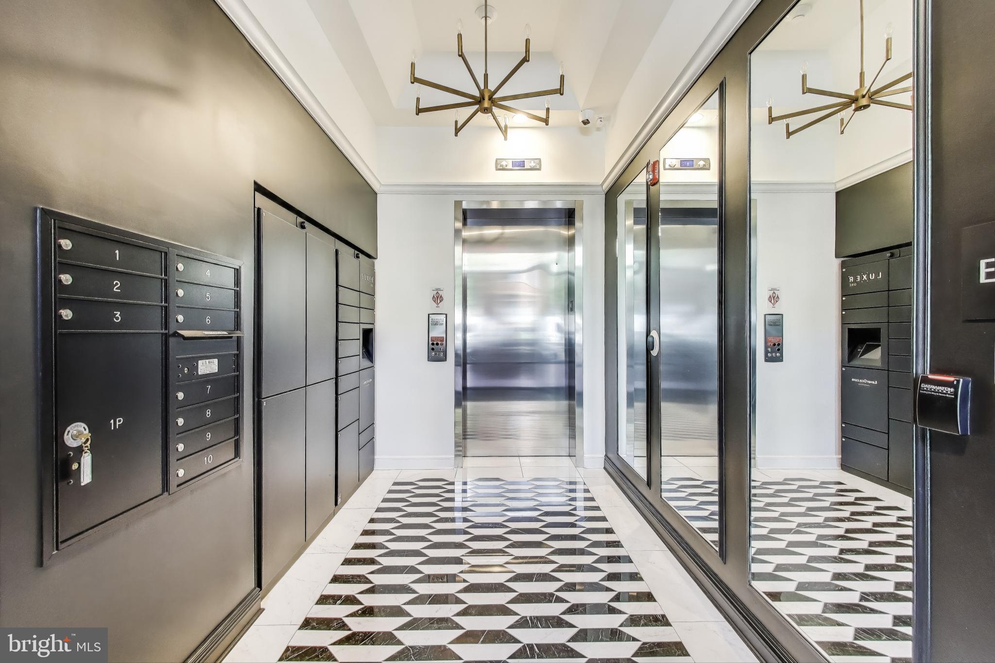 2122 N Street Northwest, Unit 5 Washington, DC 20037 - Photo 34 of 38 a bathroom with a mirror and a shower