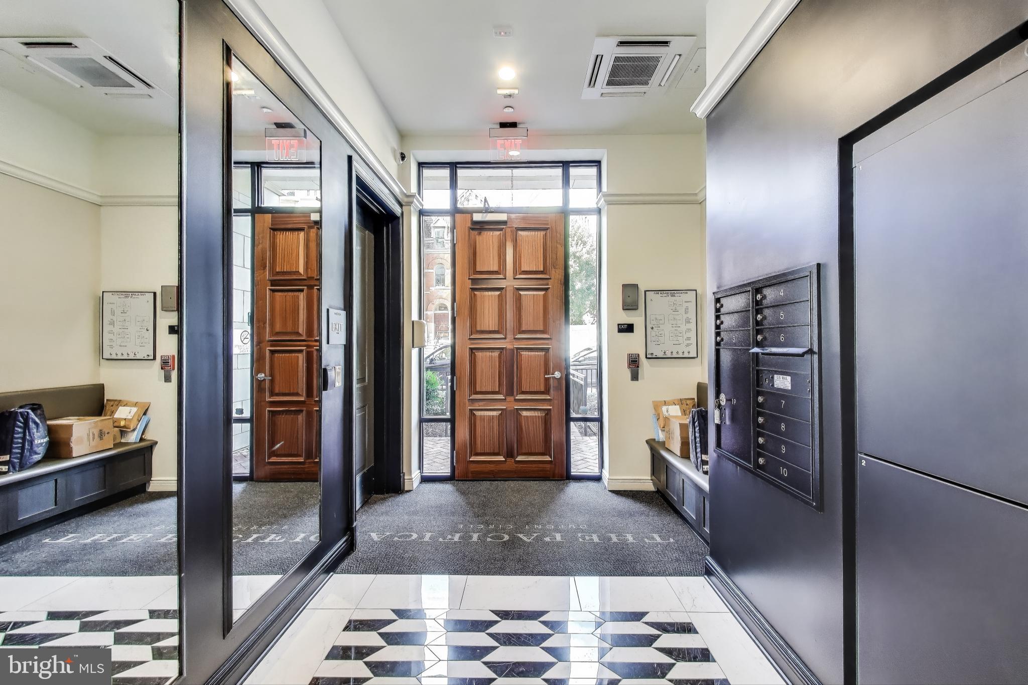 2122 N Street Northwest, Unit 5 Washington, DC 20037 - Photo 35 of 38 a bathroom with a glass door shower and a sink