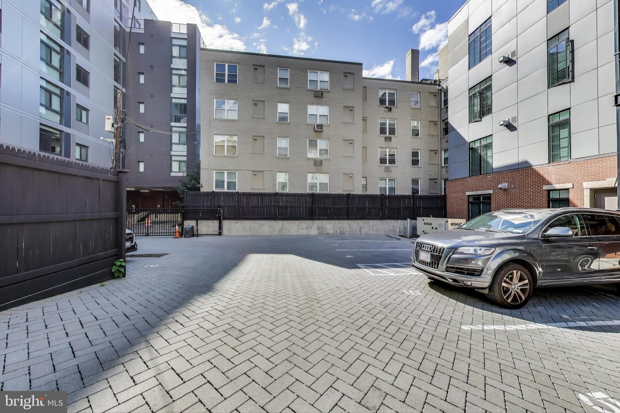 2122 N Street Northwest, Unit 5 Washington, DC 20037 - Photo 38 of 38 a car parked in front of a building