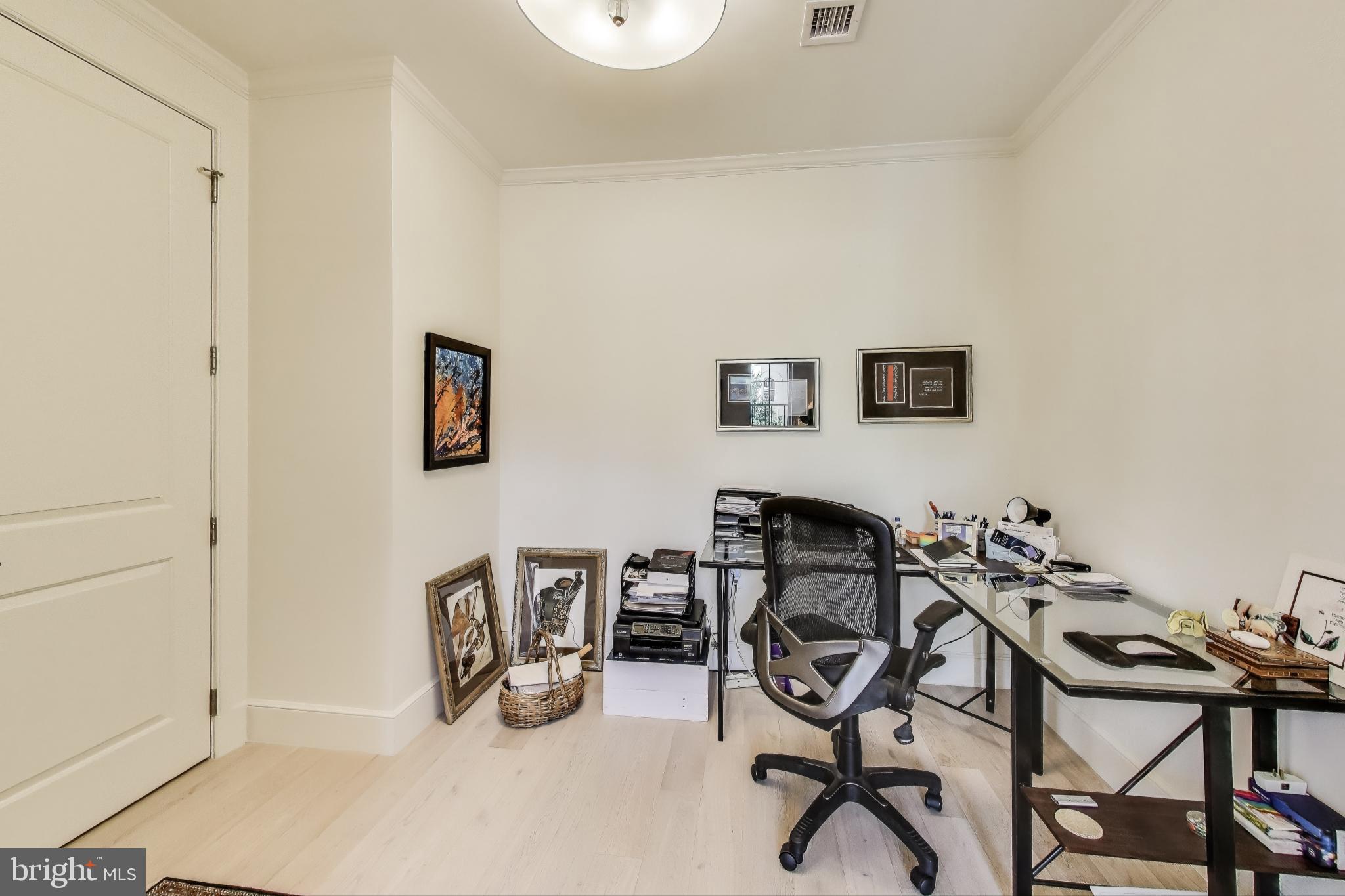 2122 N Street Northwest, Unit 5 Washington, DC 20037 - Photo 10 of 38 a view of a dining room with furniture