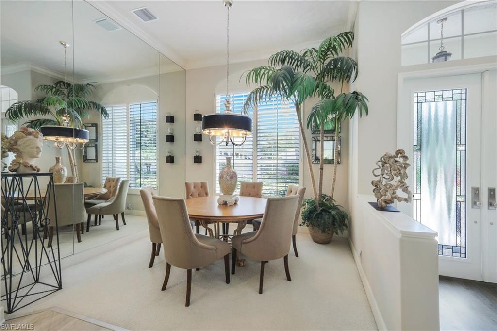 8475 Gleneagle Way Naples, FL 34120 - Photo 12 of 46 a dining room with furniture and window
