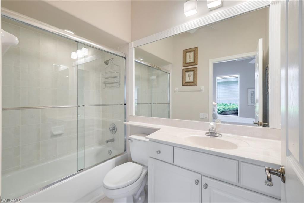 8475 Gleneagle Way Naples, FL 34120 - Photo 30 of 46 a bathroom with a sink toilet and shower