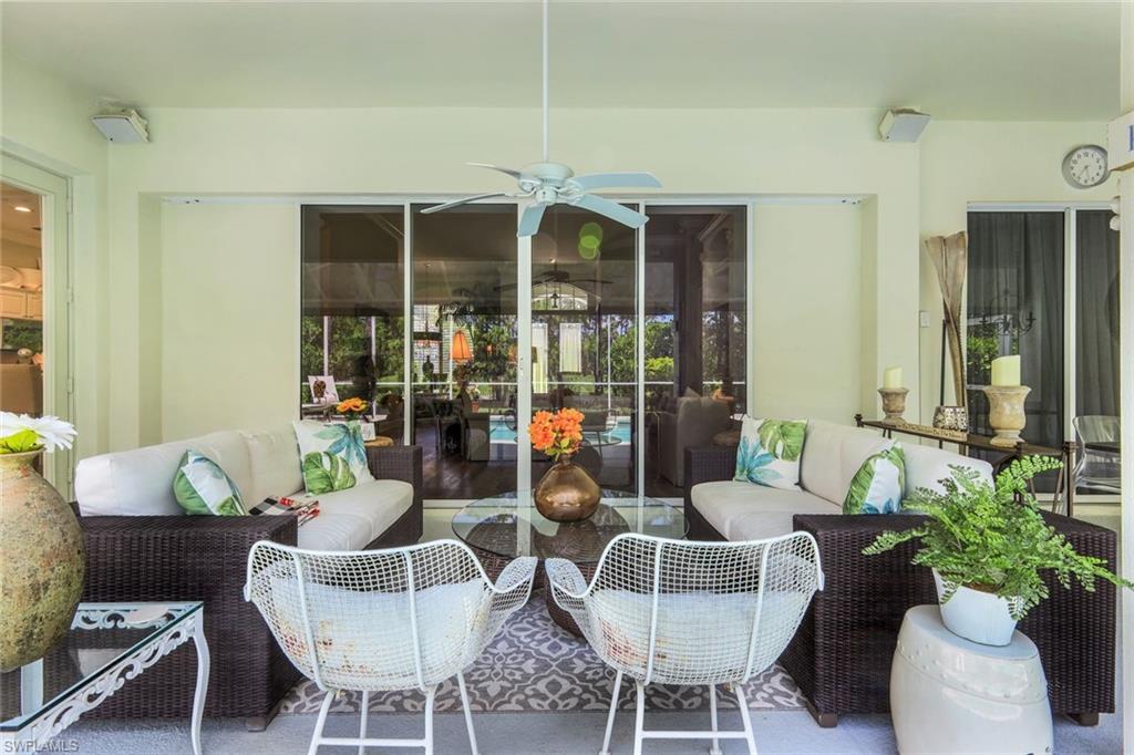 8475 Gleneagle Way Naples, FL 34120 - Photo 34 of 46 a living room with furniture and potted plant