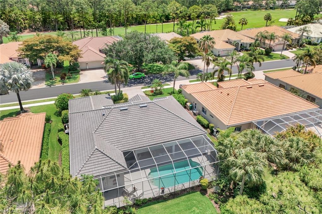 8475 Gleneagle Way Naples, FL 34120 - Photo 42 of 46 an aerial view of a house with a yard and potted plants