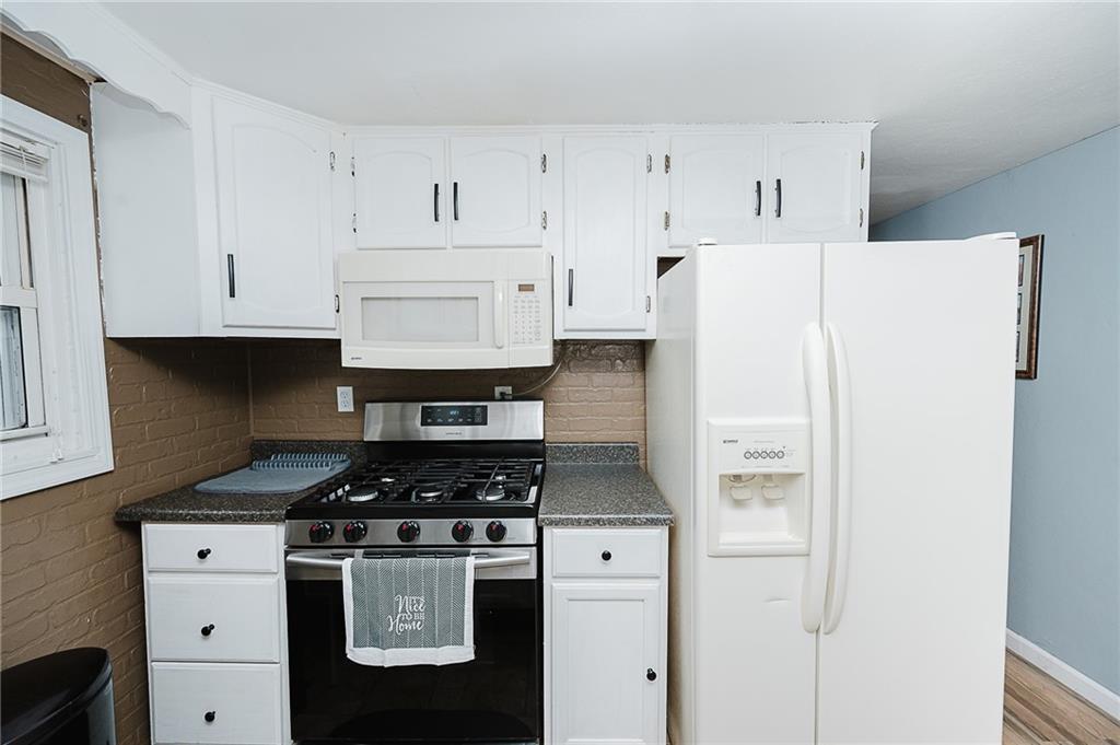 191 Bear Creek Road Sarver, PA 16055 - Photo 11 of 25 a kitchen with white cabinets and refrigerator