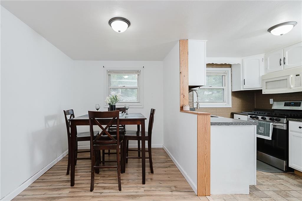 191 Bear Creek Road Sarver, PA 16055 - Photo 8 of 25 a view of a dining room with furniture and wooden floor