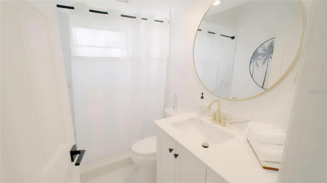a view of two chairs in the kitchen