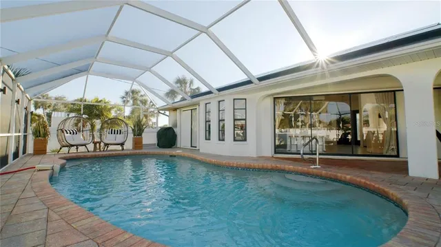 a view of a swimming pool with a patio