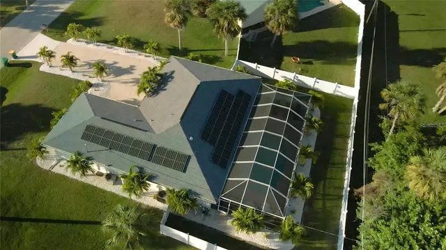 an aerial view of a residential houses with outdoor space