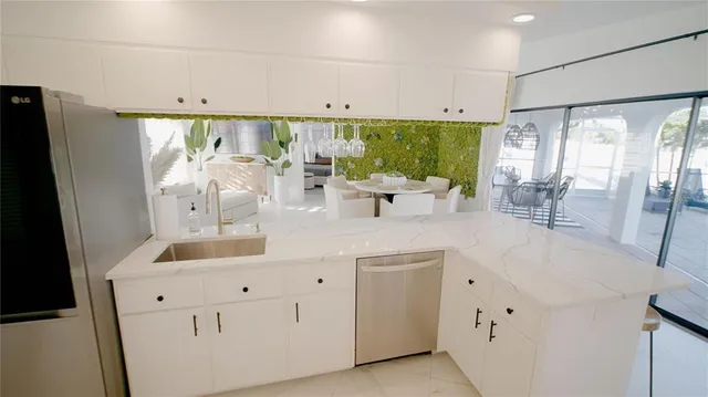 a kitchen that has a sink and a stove in it