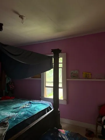 a kitchen with a sink stove and wooden floor