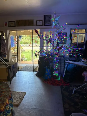 a flower garden is sitting in front of a house