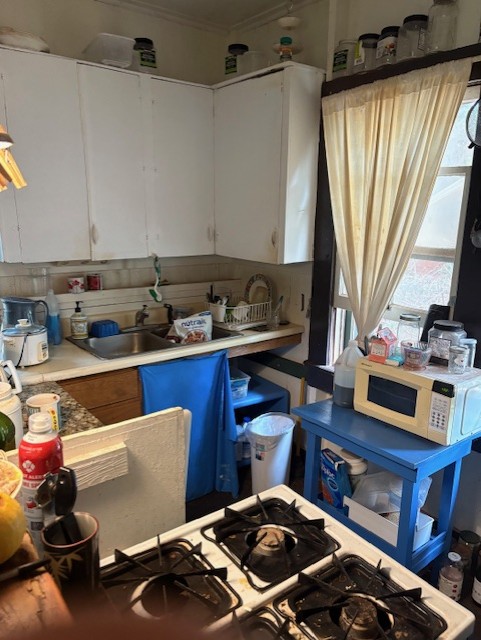 3861 Koula Road Hanapepe, HI 96716 - Photo 25 of 28 a kitchen with a stove and a sink