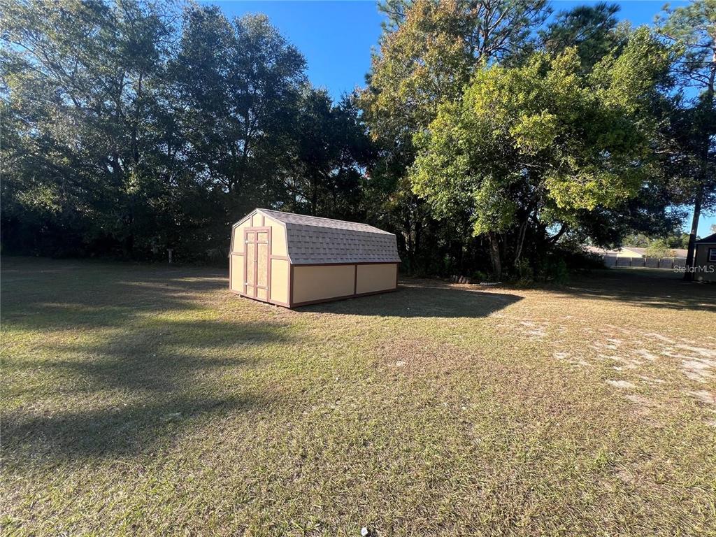 8347 Southwest 101st Place Road Ocala, FL 34481 - Photo 4 of 14 a view of a backyard