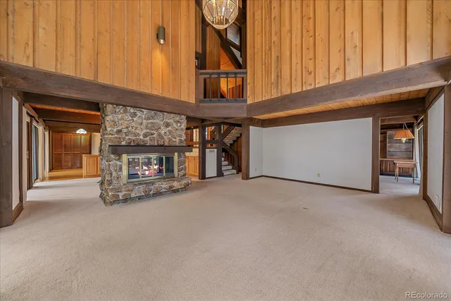 a view of an empty room with a fireplace