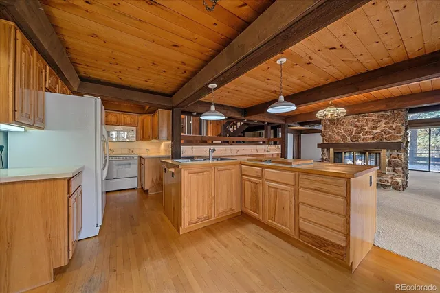 a kitchen with cabinets a sink and appliances