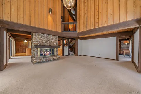 a view of an empty room with a fireplace