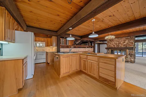 a kitchen with cabinets a sink and appliances