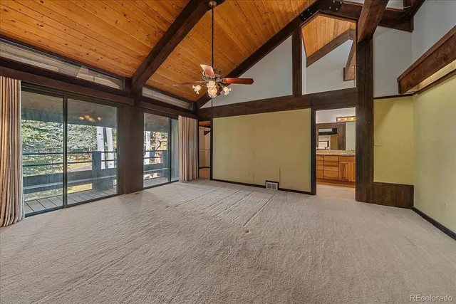 a view of an empty room with a sliding door