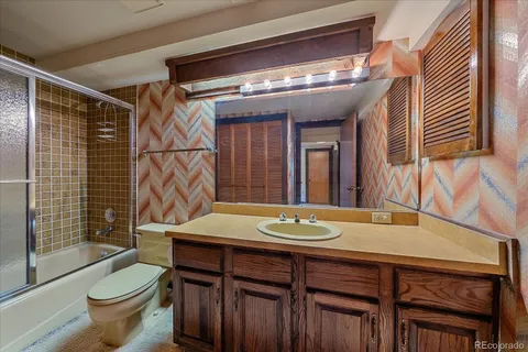 a view of a house with backyard porch and sitting area