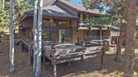 a view of a backyard with sitting area