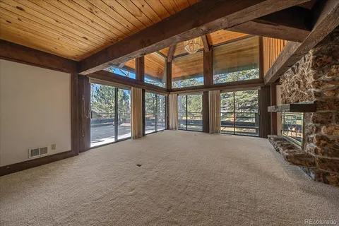 a view of an empty room with windows