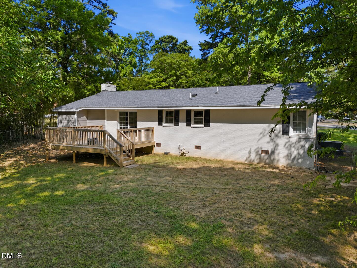 2950 Glenridge Drive Raleigh, NC 27604 - Photo 42 of 53 a house with a tree in front of it