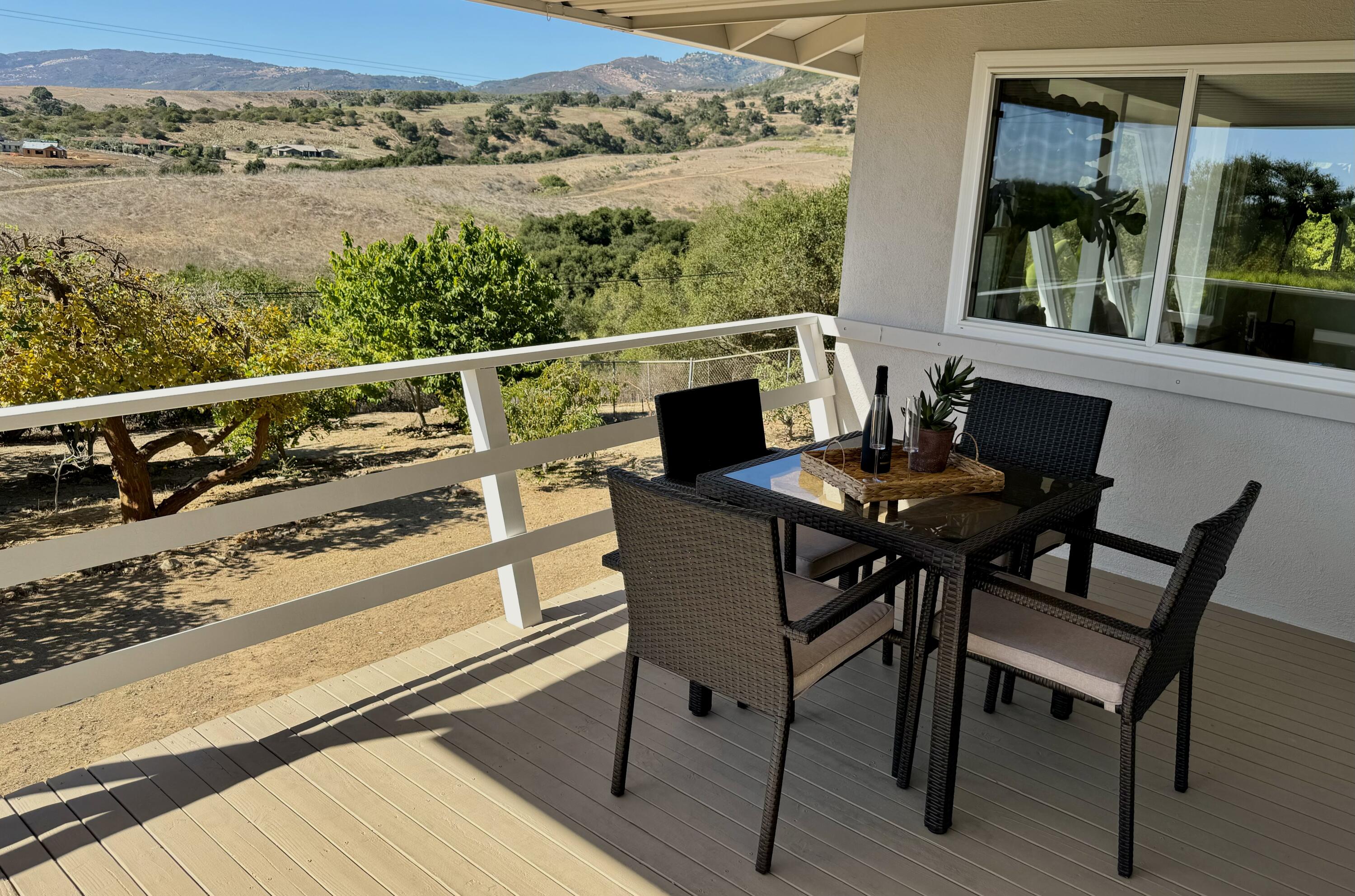 3919 Antone Road Santa Barbara, CA 93110 - Photo 20 of 38 a view of a balcony with chairs and wooden floor