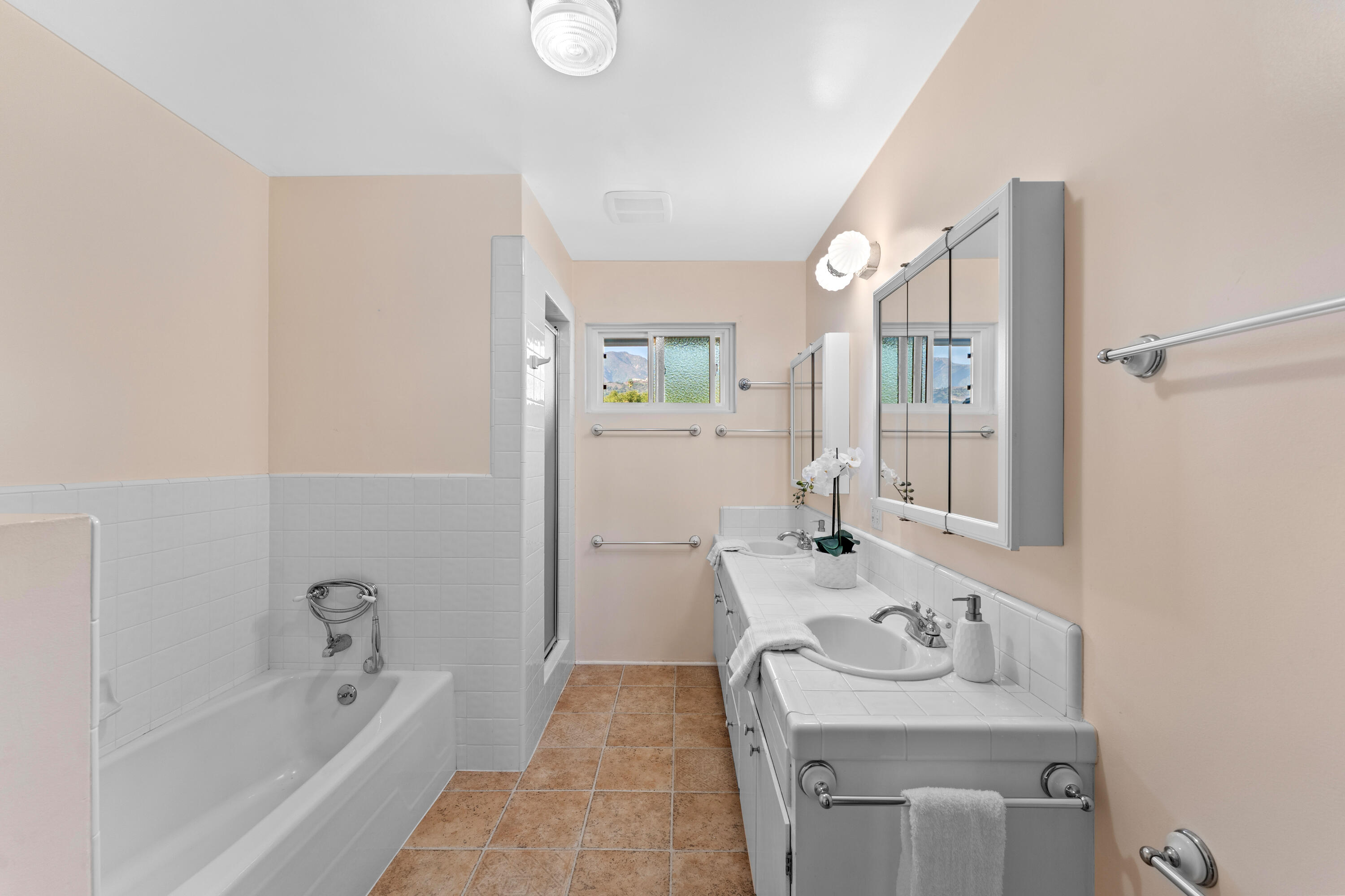 3919 Antone Road Santa Barbara, CA 93110 - Photo 28 of 38 a bathroom with a sink a toilet and shower
