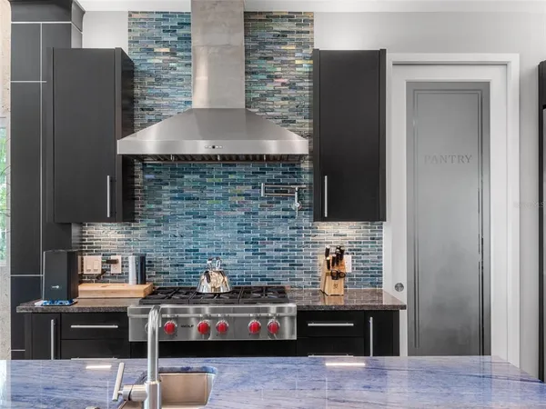 a front view of a house with swimming pool having outdoor seating