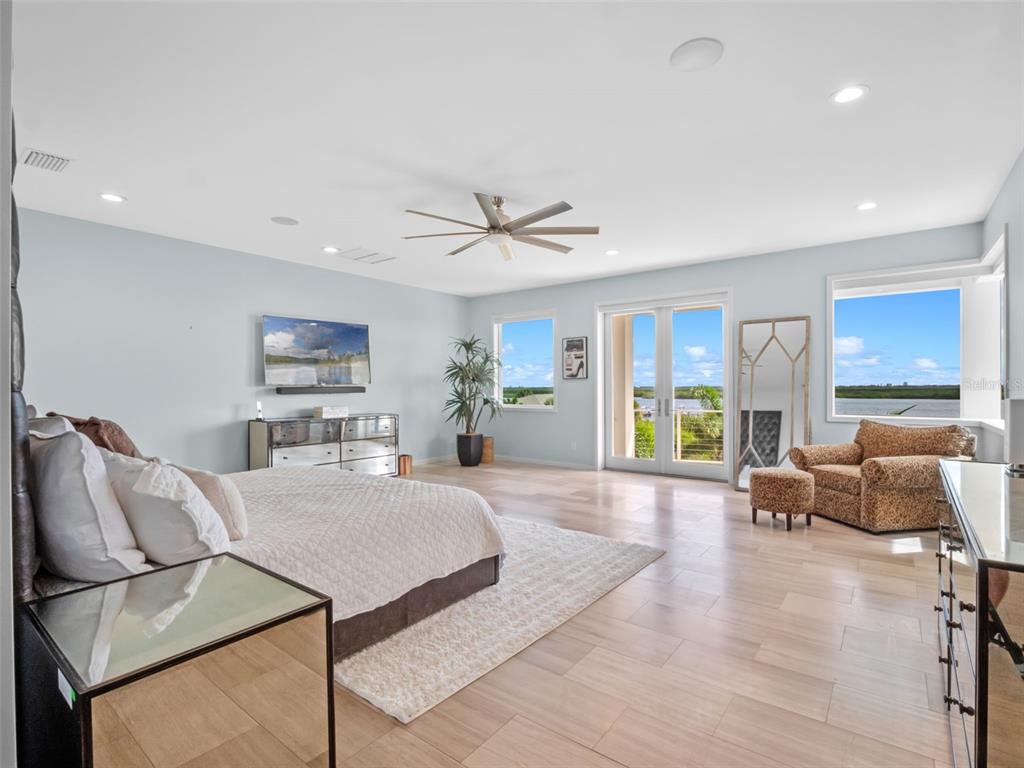 1511 South Riverside Drive New Smyrna Beach, FL 32168 - Photo 39 of 81 a living room with furniture a ceiling fan and a wooden floor