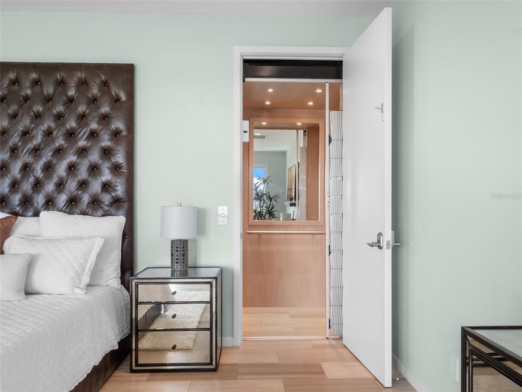 1511 South Riverside Drive New Smyrna Beach, FL 32168 - Photo 41 of 81 a view of a bedroom with furniture and wooden floor