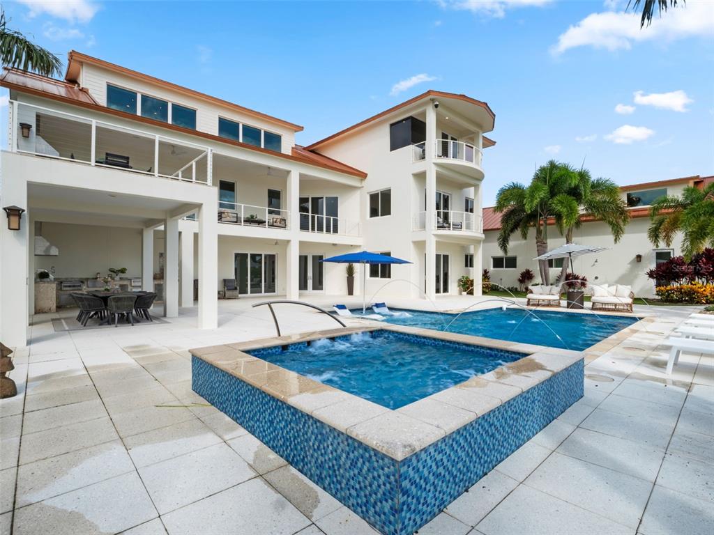 1511 South Riverside Drive New Smyrna Beach, FL 32168 - Photo 47 of 81 a front view of a house with swimming pool having outdoor seating