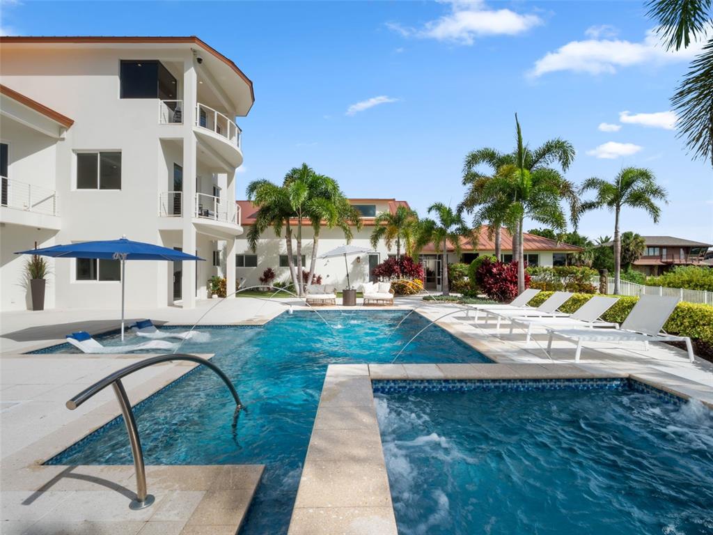 1511 South Riverside Drive New Smyrna Beach, FL 32168 - Photo 49 of 81 a view of a swimming pool with lounge chairs