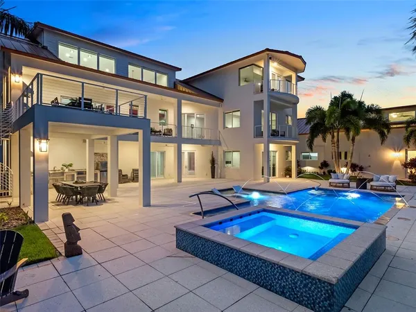 a house view with a sitting space and swimming pool