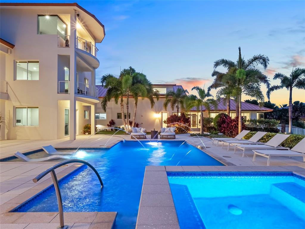 1511 South Riverside Drive New Smyrna Beach, FL 32168 - Photo 7 of 81 a view of a house with swimming pool yard and sitting area