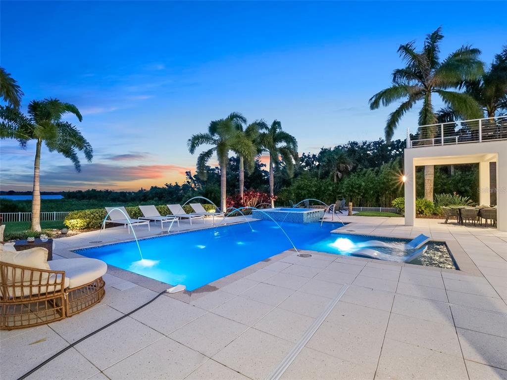 1511 South Riverside Drive New Smyrna Beach, FL 32168 - Photo 10 of 81 a view of swimming pool with outdoor seating and yard