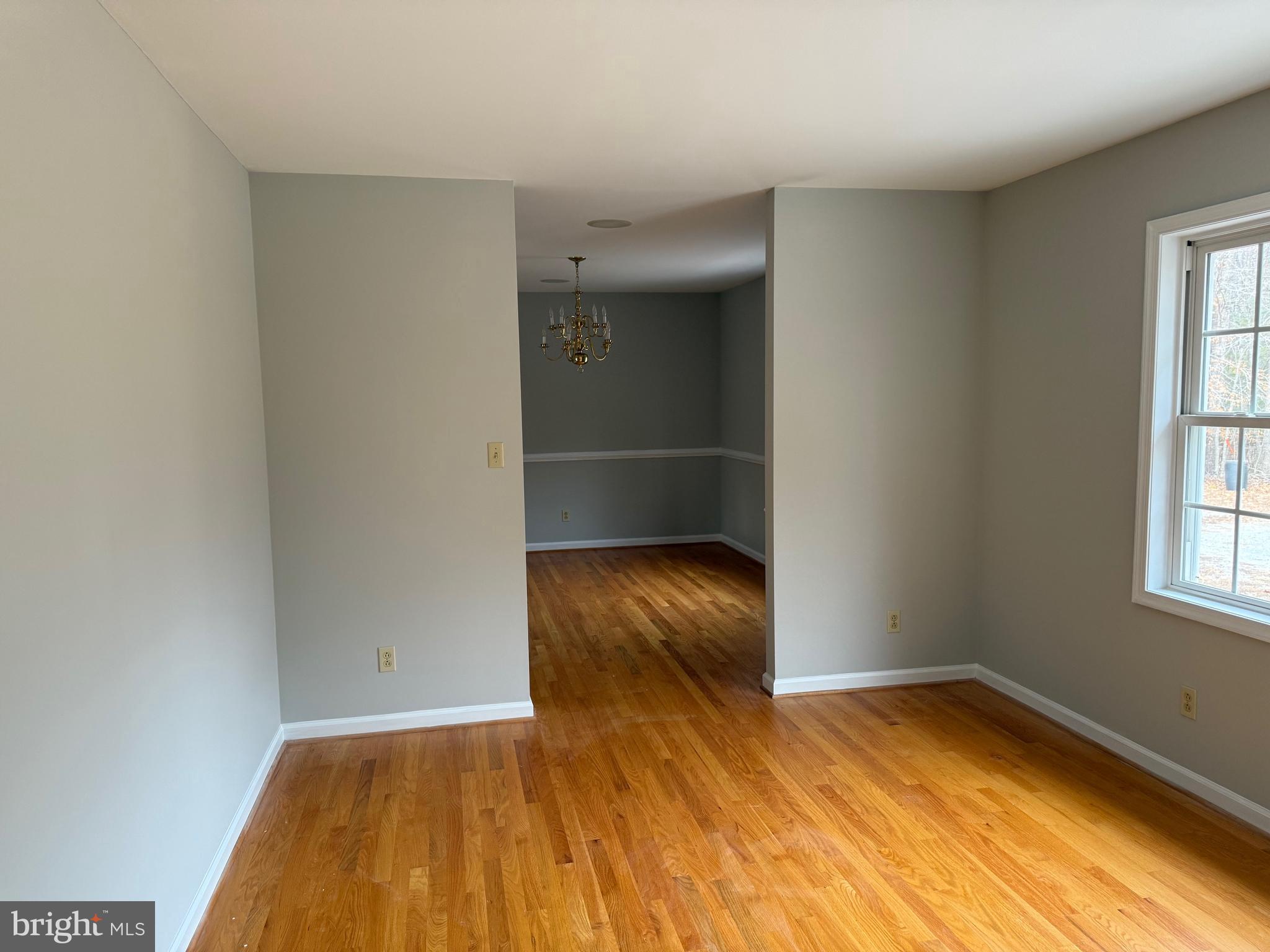 5545 Yanceyville Road Louisa, VA 23093 - Photo 13 of 63 an empty room with a natural light