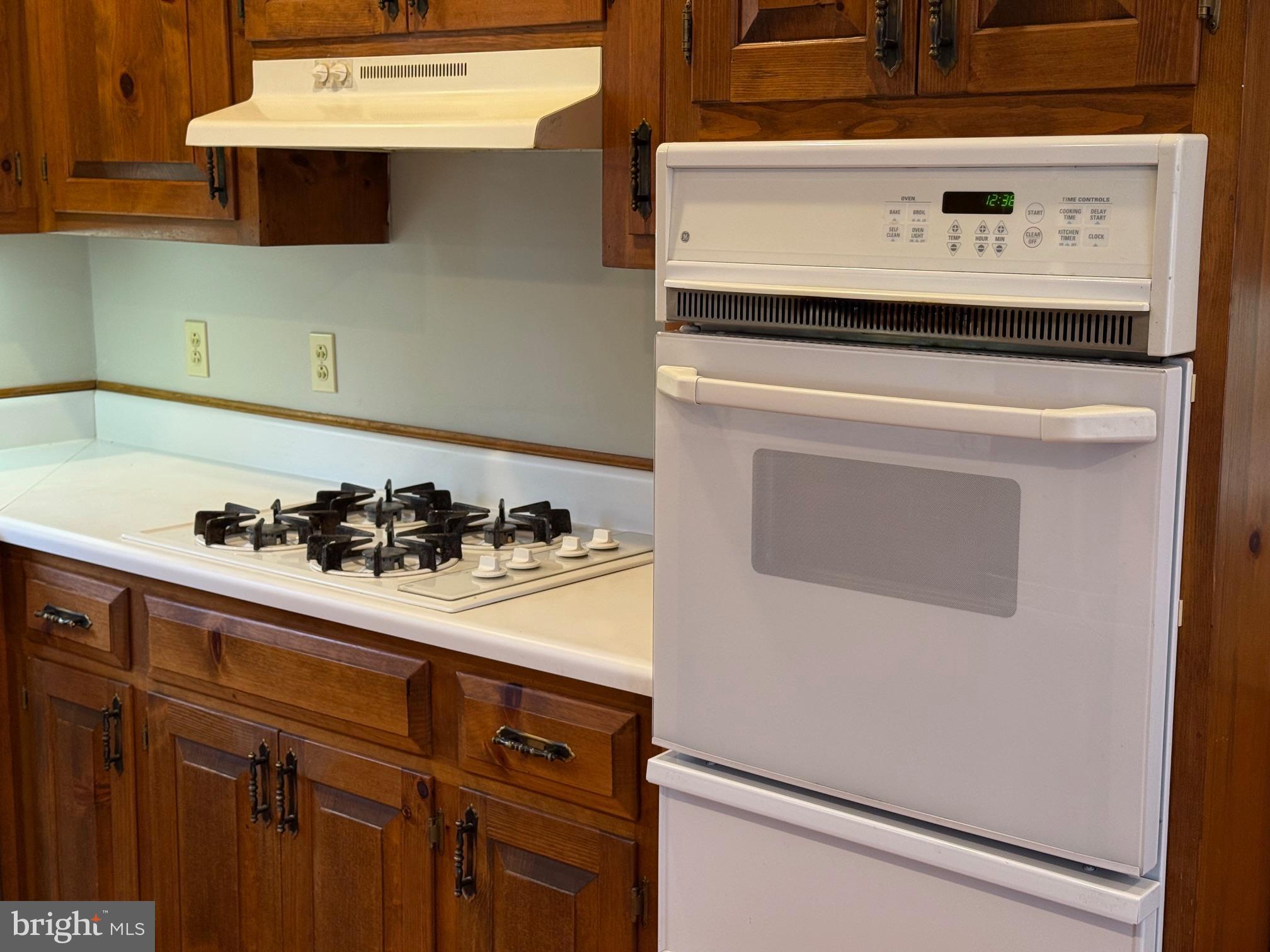 5545 Yanceyville Road Louisa, VA 23093 - Photo 19 of 64 a white stove top oven sitting inside of a kitchen