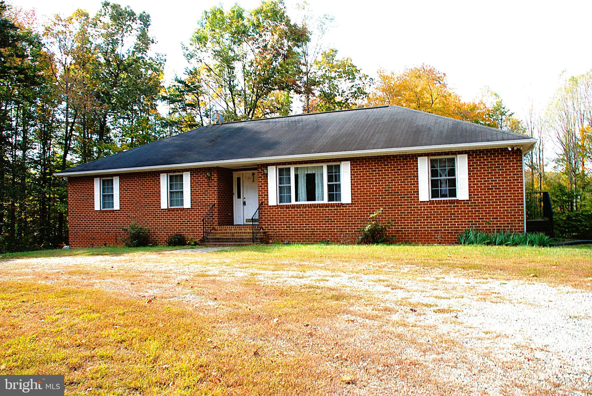 5545 Yanceyville Road Louisa, VA 23093 - Photo 2 of 63 a house view with a garden space