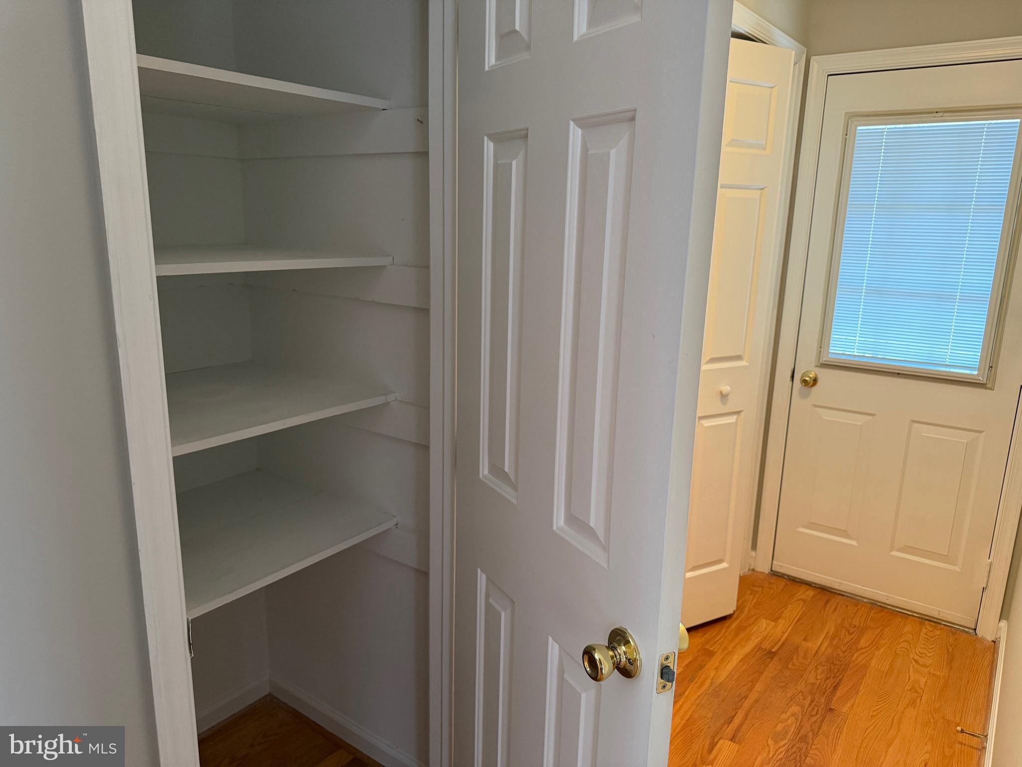 5545 Yanceyville Road Louisa, VA 23093 - Photo 21 of 64 a view of a hallway with wooden floor and closet