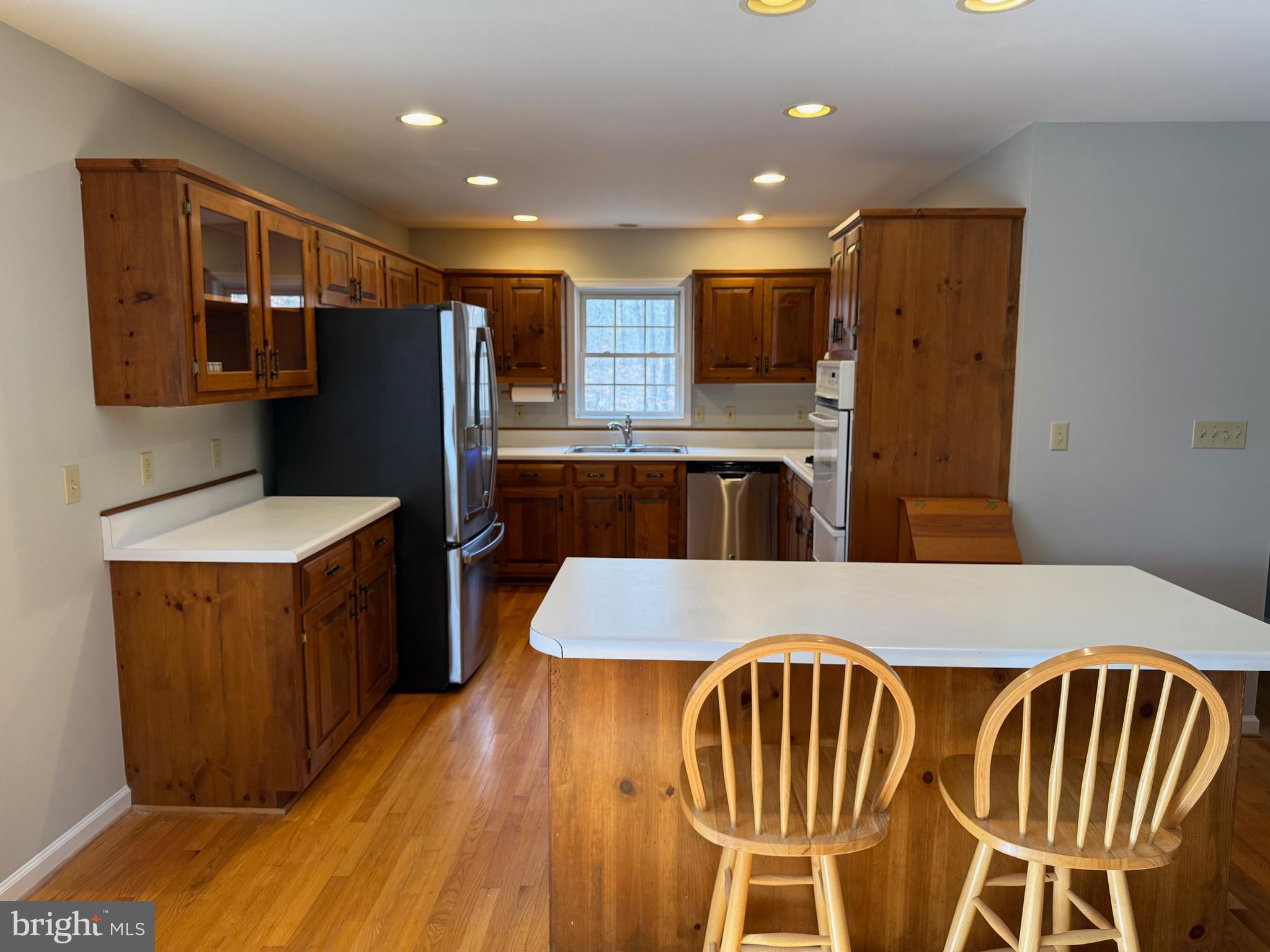 5545 Yanceyville Road Louisa, VA 23093 - Photo 21 of 63 a kitchen with kitchen island a counter top space appliances and cabinets
