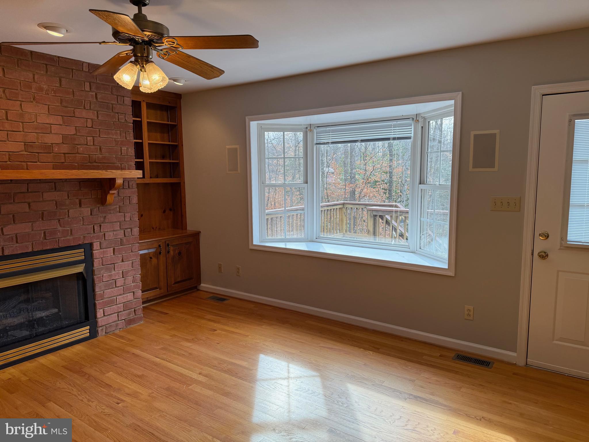 5545 Yanceyville Road Louisa, VA 23093 - Photo 22 of 64 a view of an empty room with window and wooden floor
