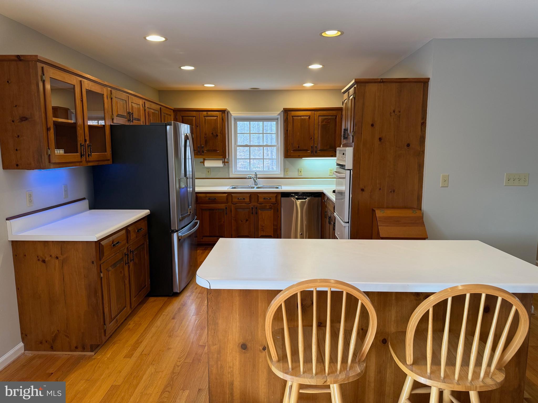 5545 Yanceyville Road Louisa, VA 23093 - Photo 22 of 63 a kitchen with stainless steel appliances granite countertop a refrigerator a stove top oven and a sink
