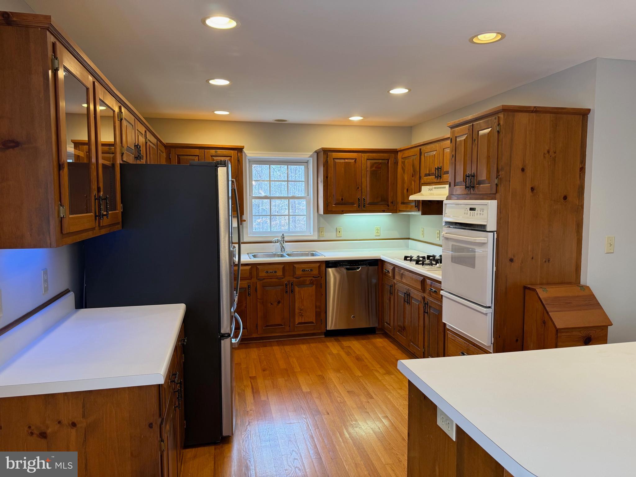 5545 Yanceyville Road Louisa, VA 23093 - Photo 25 of 63 a kitchen with stainless steel appliances a refrigerator and a stove top oven